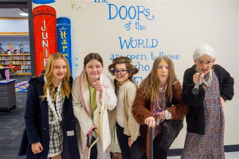 five girls with canes and wigs